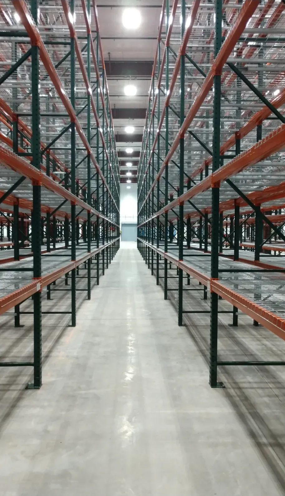Pallet racking in a warehouse aisle served by Progressive Handling Inc.